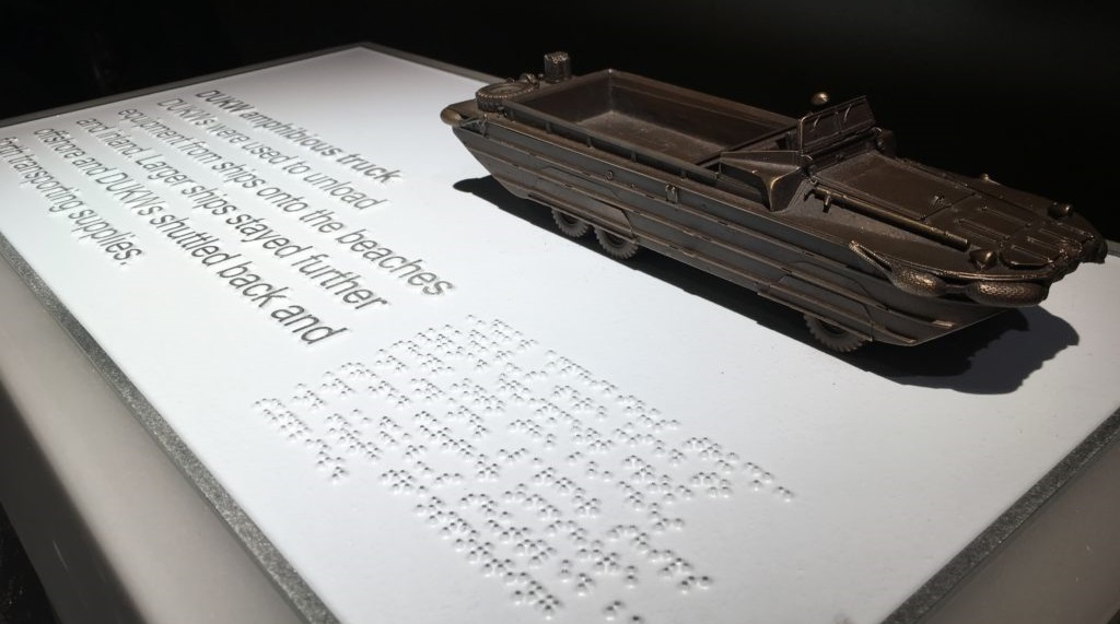 Handling object of LCT 7074 at The D-Day Story, with Braille for the explanatory text